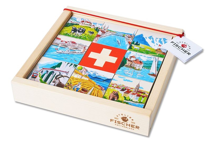 Das Memory von Atelier Fischer in der Holzbox mit Schweizer Motiven auf den Plättchen.
